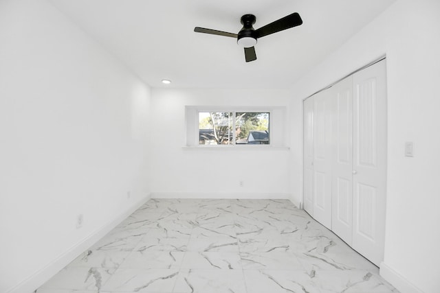 unfurnished bedroom featuring a closet and ceiling fan