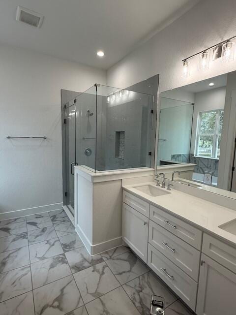 bathroom with vanity and an enclosed shower