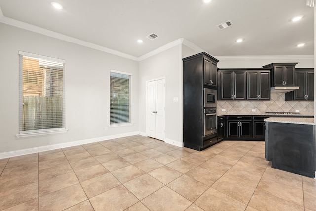 kitchen featuring tasteful backsplash, crown molding, light tile patterned floors, and appliances with stainless steel finishes