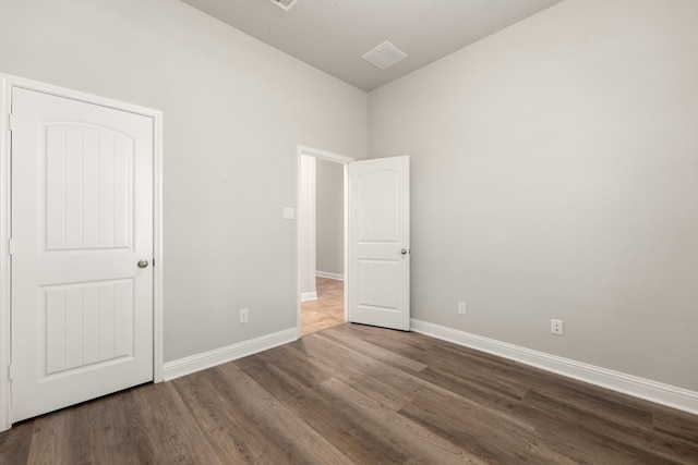 unfurnished bedroom with wood-type flooring