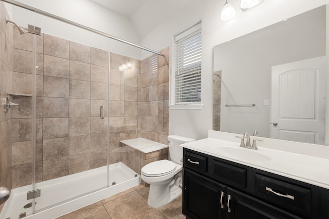 bathroom with tile patterned flooring, vanity, toilet, and an enclosed shower