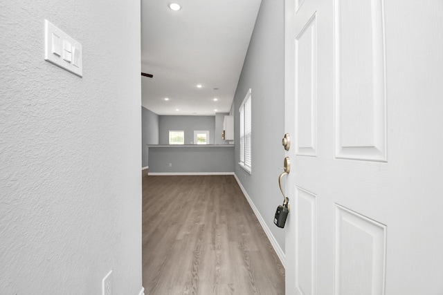 hall with light wood-type flooring