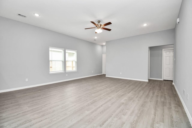 unfurnished room with light wood-type flooring and ceiling fan