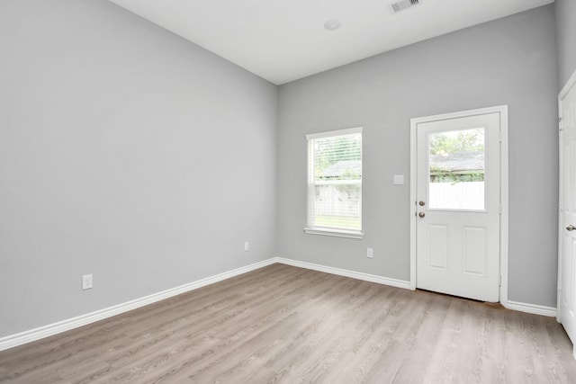 entryway with light hardwood / wood-style floors