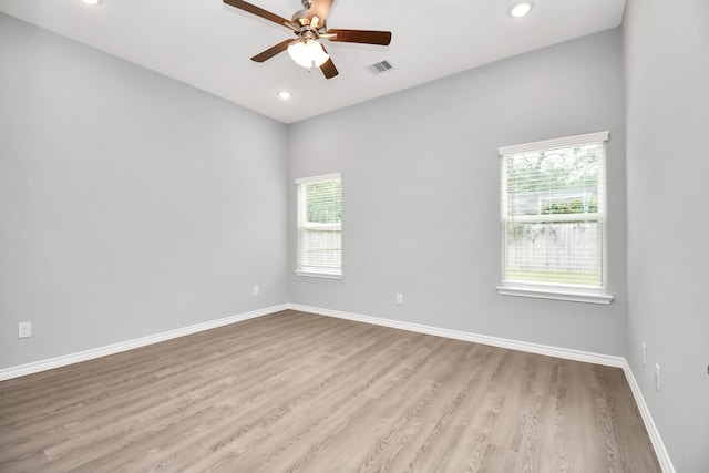 unfurnished room with ceiling fan, a healthy amount of sunlight, and light hardwood / wood-style flooring