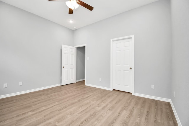 unfurnished bedroom featuring ceiling fan and light hardwood / wood-style floors