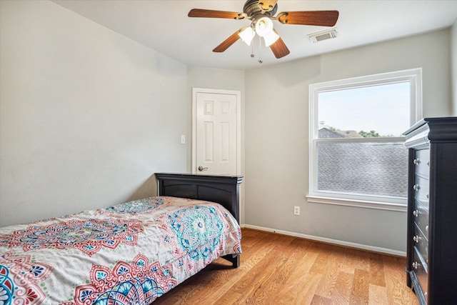 bedroom with ceiling fan and light hardwood / wood-style flooring