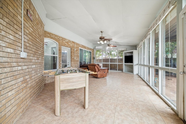 sunroom / solarium with ceiling fan