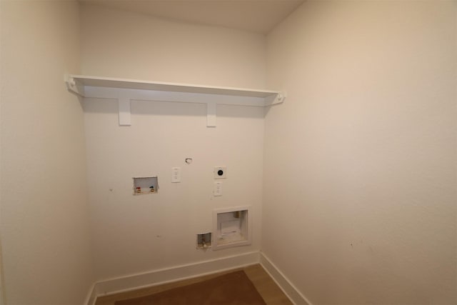 clothes washing area with baseboards, dark wood finished floors, laundry area, hookup for a washing machine, and electric dryer hookup