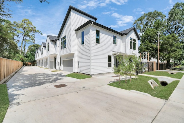 view of side of home featuring a garage