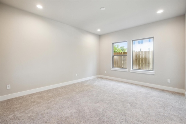 unfurnished room with carpet flooring