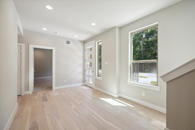 empty room with light wood-type flooring