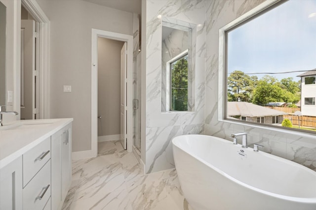 bathroom with vanity, a healthy amount of sunlight, shower with separate bathtub, and tile walls