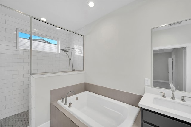 bathroom with shower with separate bathtub and vanity