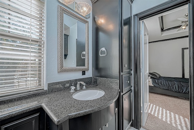 bathroom with ceiling fan and sink