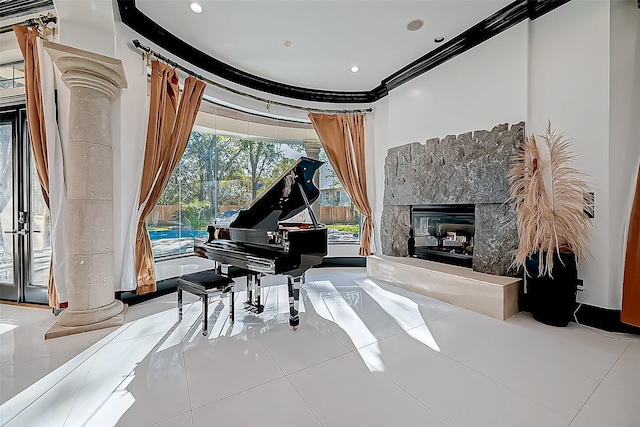 misc room with a high end fireplace, light tile patterned flooring, and ornamental molding