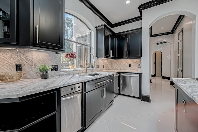 kitchen featuring dishwasher, plenty of natural light, crown molding, and sink