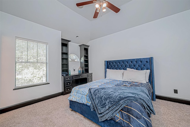 carpeted bedroom with ceiling fan and lofted ceiling