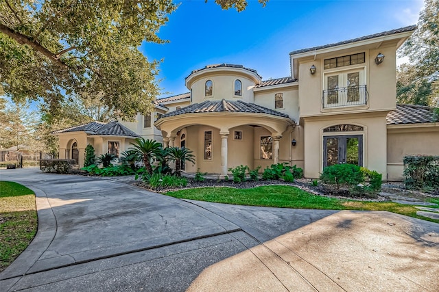 mediterranean / spanish-style home featuring french doors