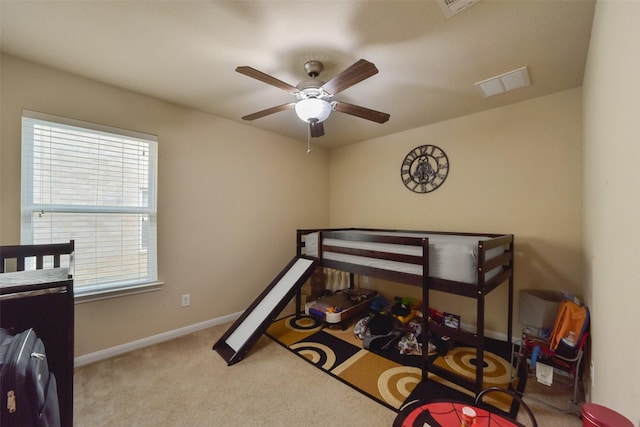 carpeted bedroom featuring ceiling fan