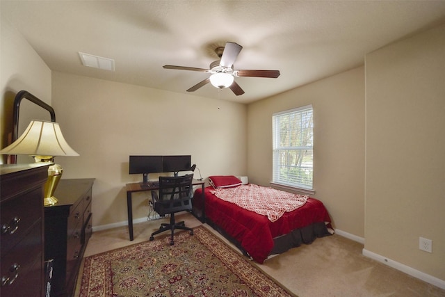 bedroom with ceiling fan and light colored carpet