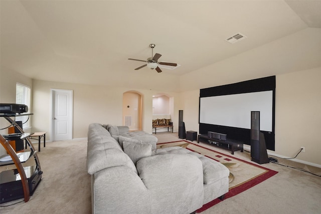 carpeted living room featuring ceiling fan and lofted ceiling