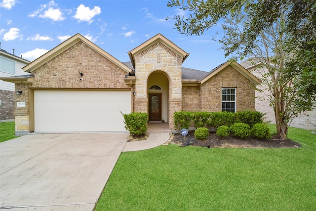 view of front of house with a garage and a front yard