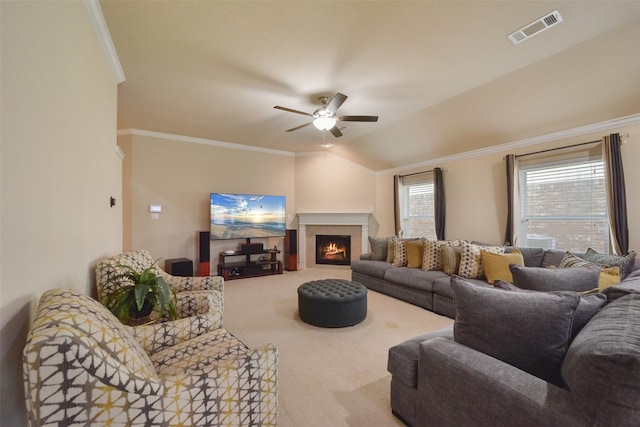 living room with carpet flooring, crown molding, and lofted ceiling