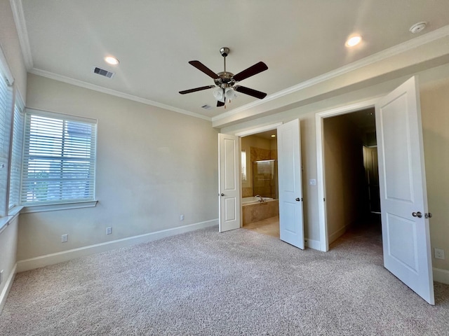 unfurnished bedroom with ensuite bath, ceiling fan, light carpet, and ornamental molding