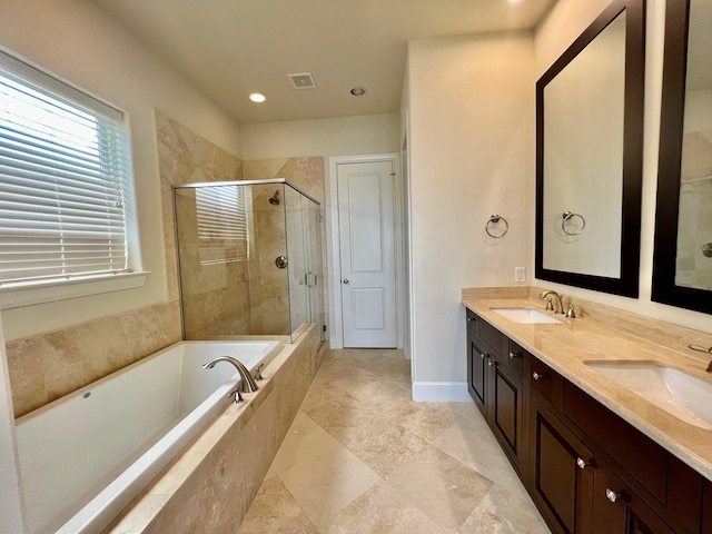 bathroom featuring vanity and plus walk in shower