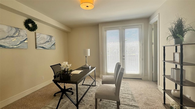 office area featuring light carpet