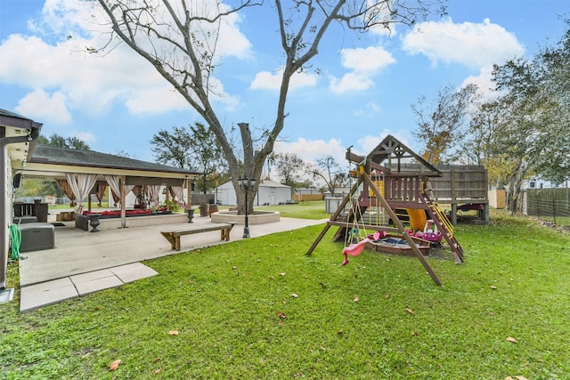 view of play area with a gazebo, a patio area, and a yard