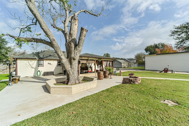 exterior space featuring a patio area and a fire pit