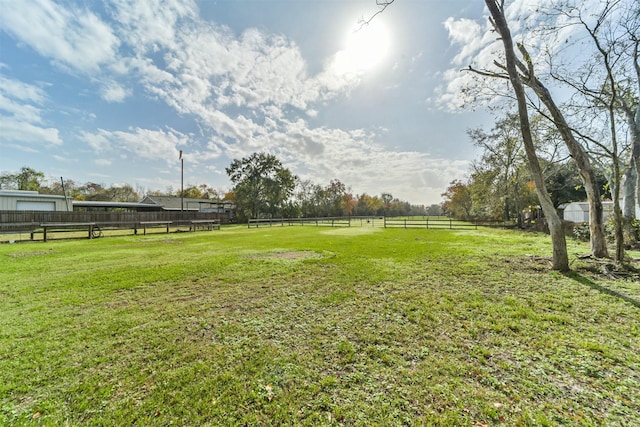 view of yard with a rural view