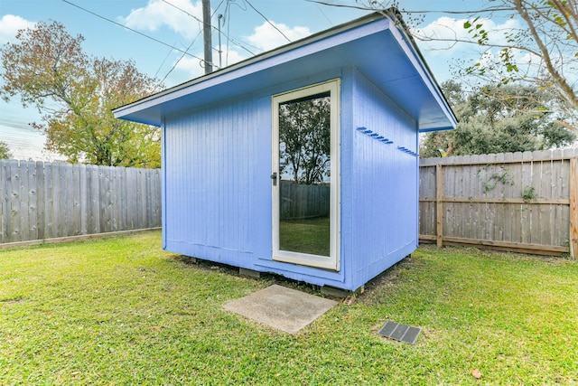 view of shed with a fenced backyard