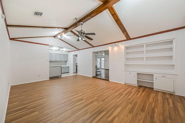 unfurnished living room featuring vaulted ceiling with beams, built in desk, visible vents, light wood-style floors, and ceiling fan