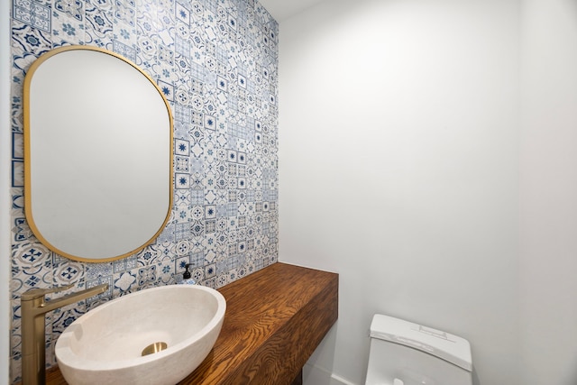 bathroom with sink and toilet