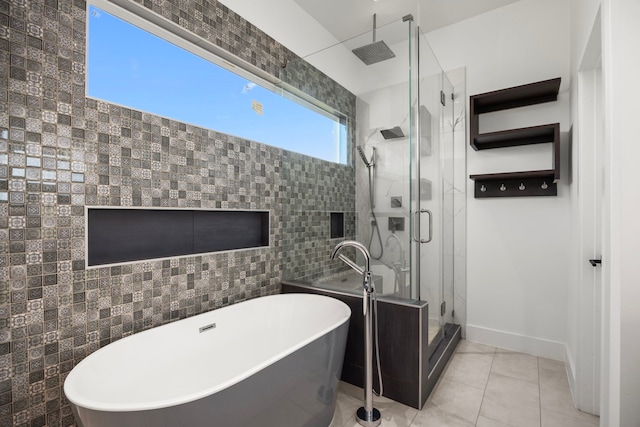 bathroom featuring separate shower and tub, tile walls, and tile patterned flooring