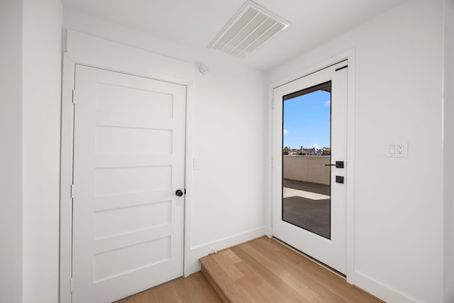 entryway with light hardwood / wood-style flooring