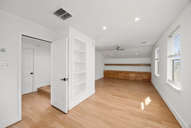 interior space with built in features and light hardwood / wood-style flooring