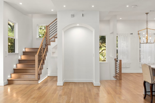 interior space featuring hardwood / wood-style floors and a chandelier