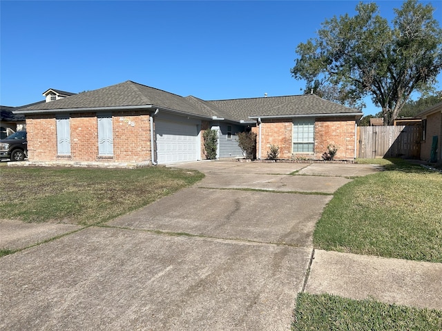 ranch-style home with a garage and a front lawn