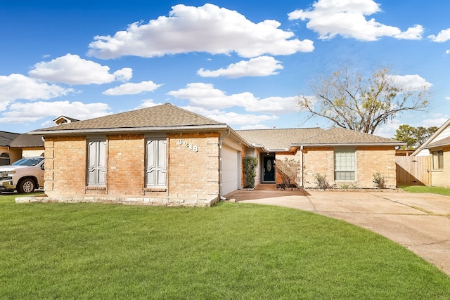 view of front facade with a garage and a front lawn