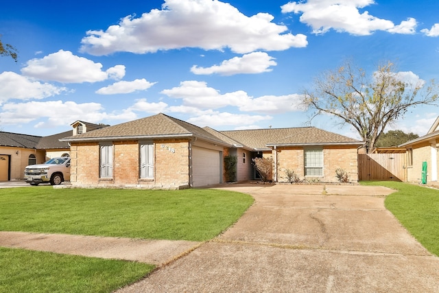 ranch-style house featuring a front yard and a garage