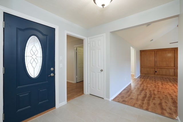 entryway featuring lofted ceiling