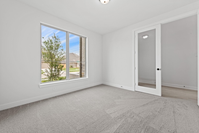 unfurnished room featuring carpet floors