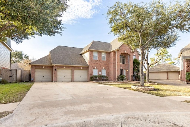 view of front facade with a front lawn and a garage