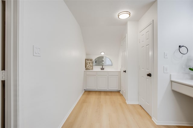 bathroom with hardwood / wood-style floors and vanity