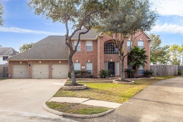 view of property featuring a front lawn