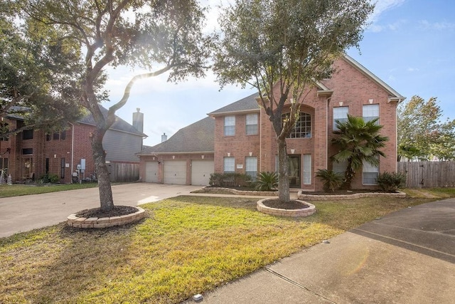 front of property with a garage and a front lawn